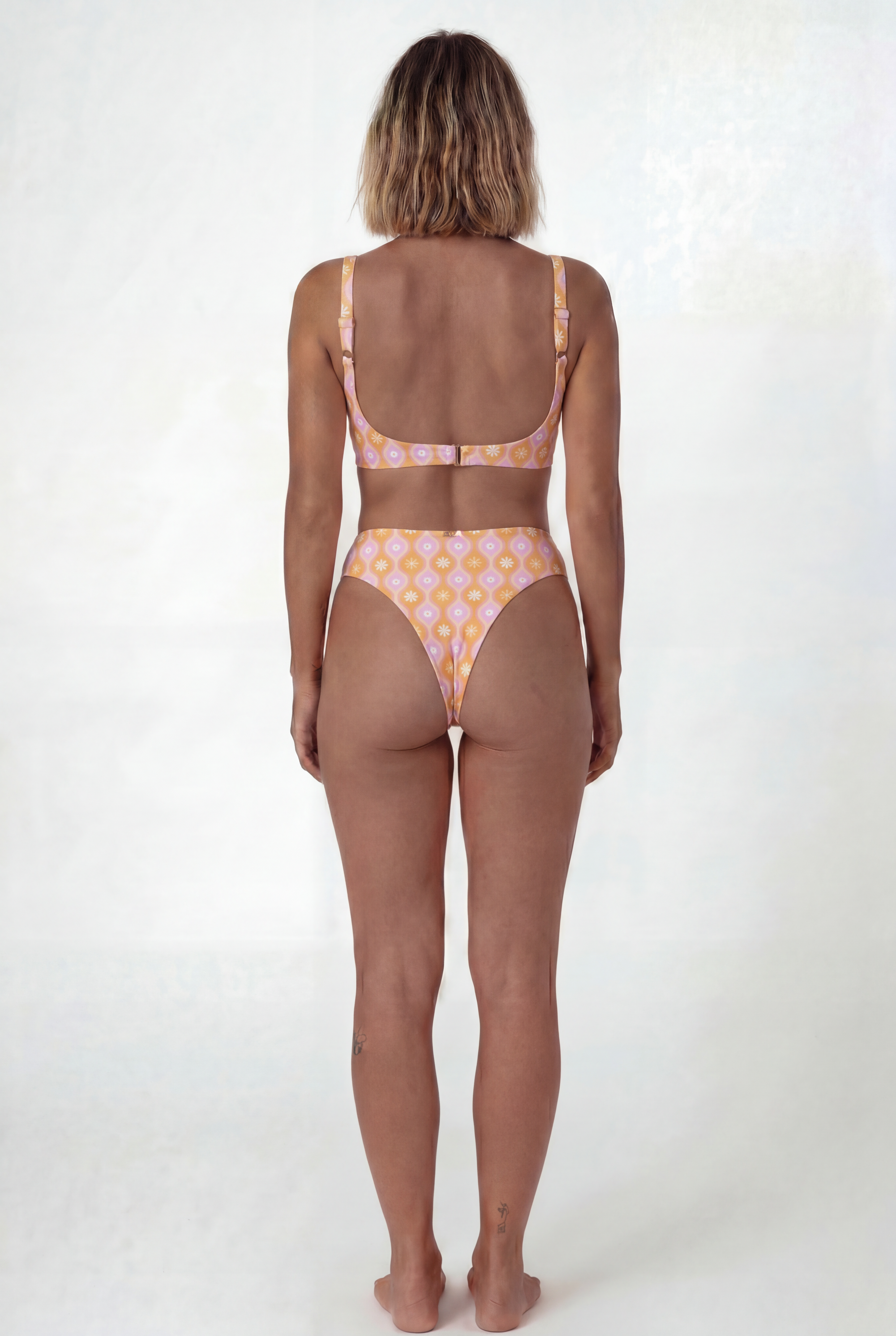 Yolo sporty bralette bikini top Marga Orange – REPREVE® recycled swimwear | Ula